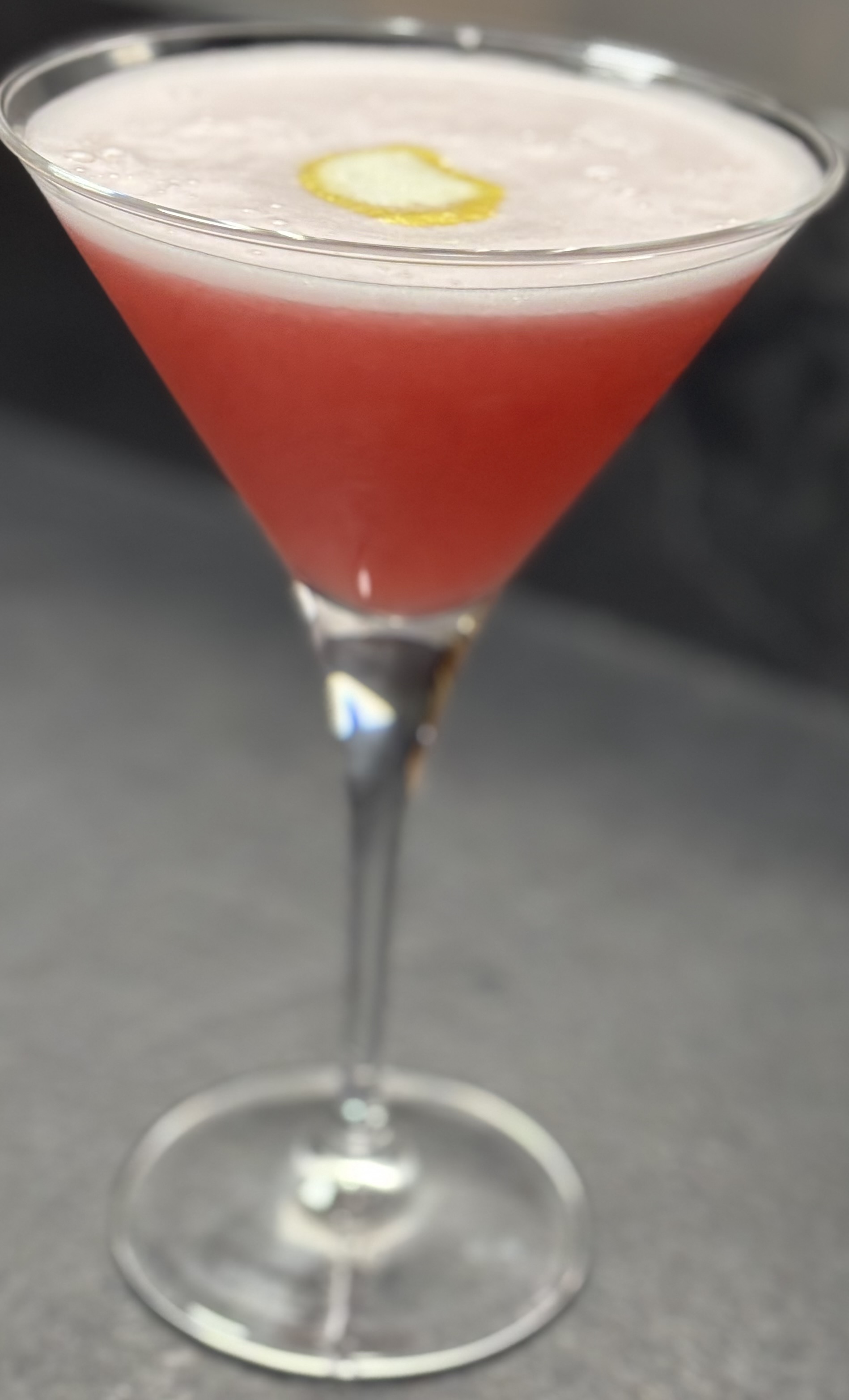 2 citron presse
1 blanc d'oeufs
4.5 de gin
3 calvados 
2 cl de sirop de cannes
Sirop de grenadine 